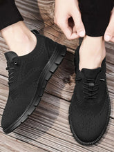 Men's mesh lace-up athletic sneakers by Trendsi with breathable PU leather and rubber sole, designed for comfort and style.