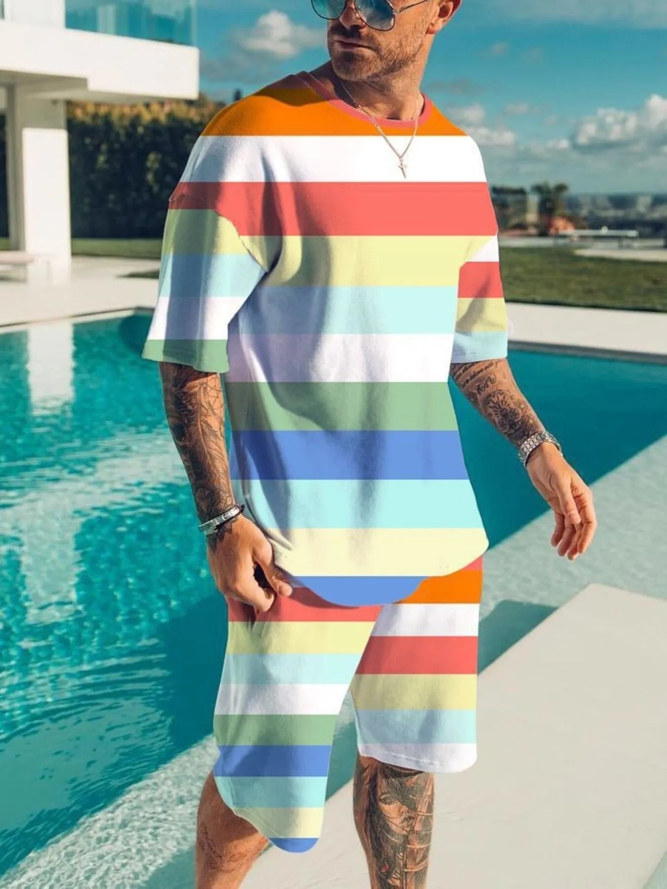 Men's color block tee and shorts set in plus size, casual two-piece outfit by Trendsi, featuring vibrant color blocking and comfortable fit.