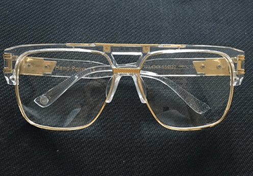Pair of men's sunglasses by Memories but Unique featuring stylish frames and dark tinted lenses for outdoor wear.