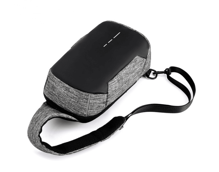Waterproof anti-theft men's travel chest bag from Memories but Unique with multiple compartments and adjustable strap.