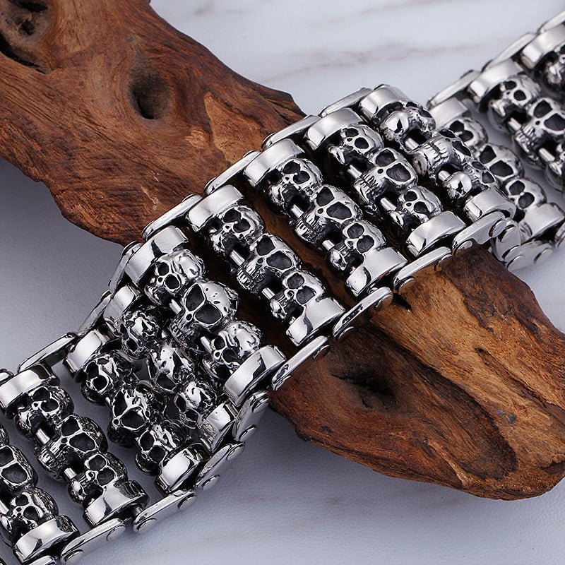 Men's titanium steel skull bracelet with punk style design, featuring detailed skull charms and edgy jewelry craftsmanship.