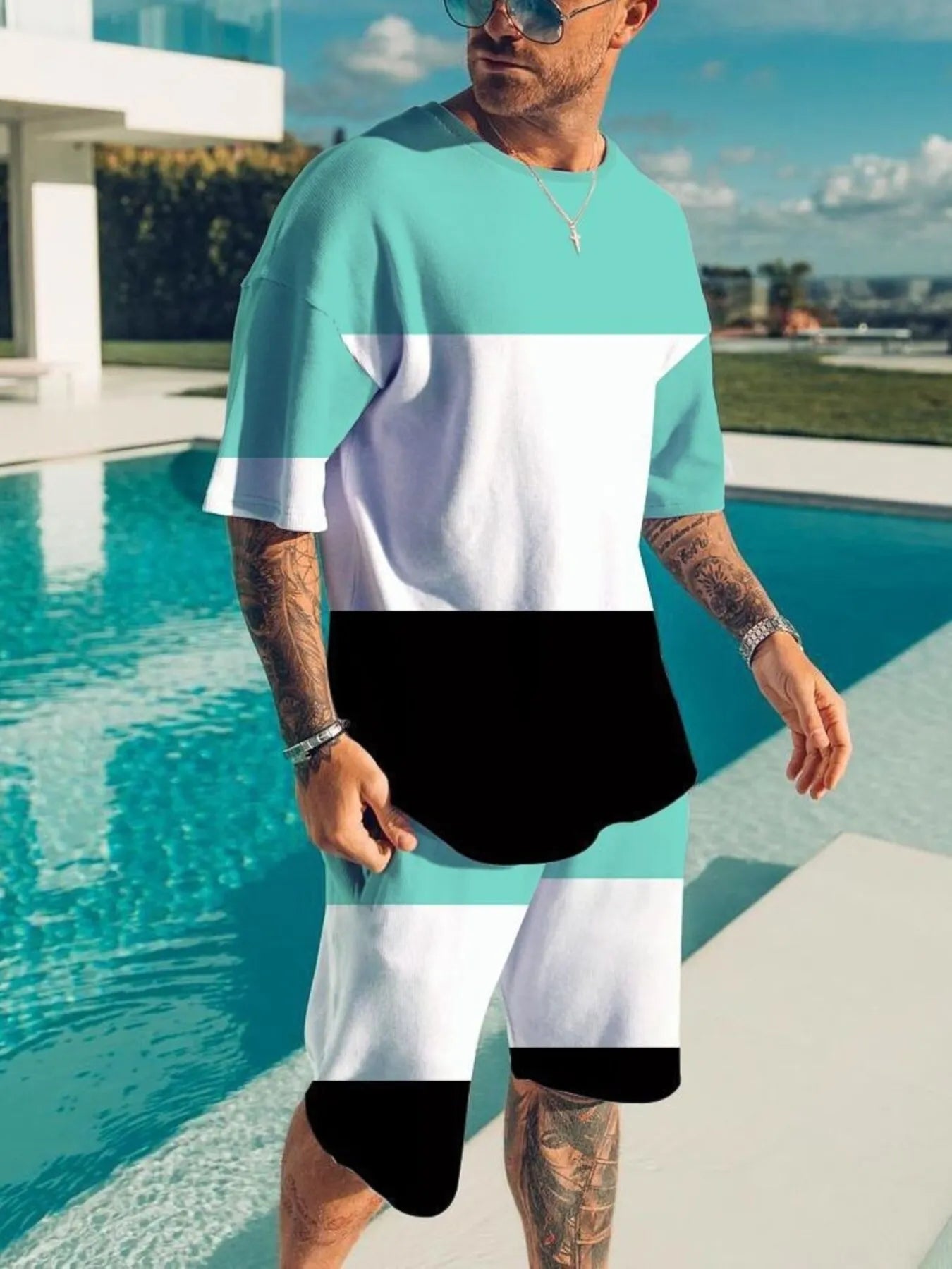 Men's color block tee and shorts set in plus size from Trendsi, featuring a stylish two-piece casual outfit with vibrant color blocks.