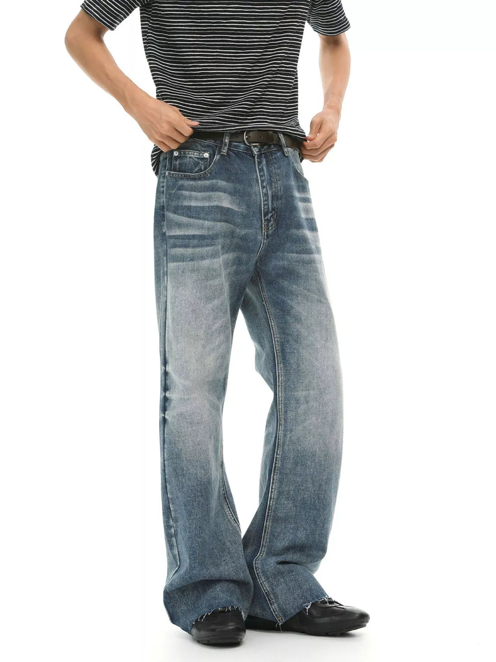 Men's vintage wash flare jeans with raw hem and pockets, trendy denim from Trendsi, styled with a relaxed fit and classic details.
