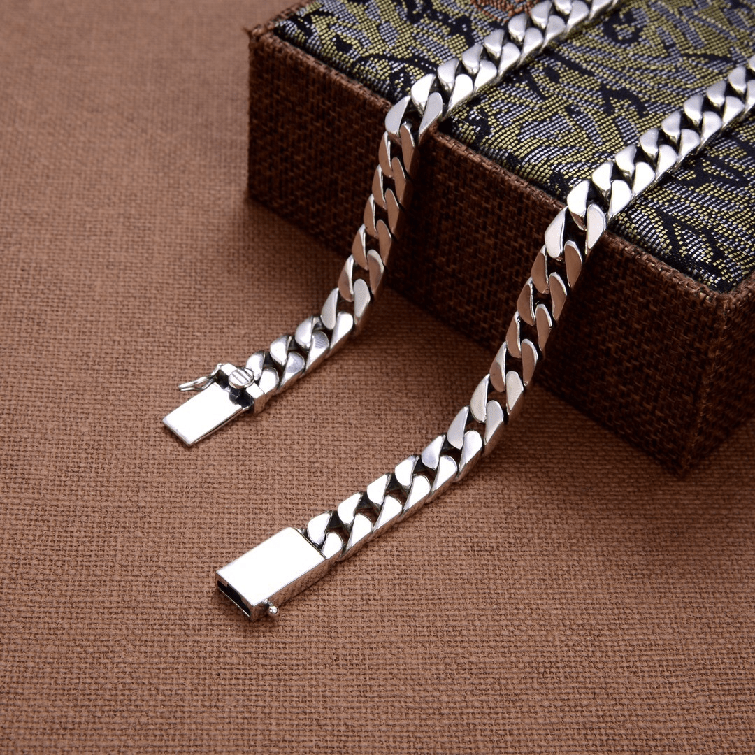 Men's fashion chain clutch by Memories but Unique with sleek design and metallic chain strap, ideal for stylish accessories.