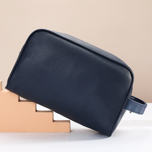 Men's travel cosmetic bag in PU leather by Zen, featuring organized compartments for toiletries and grooming essentials.