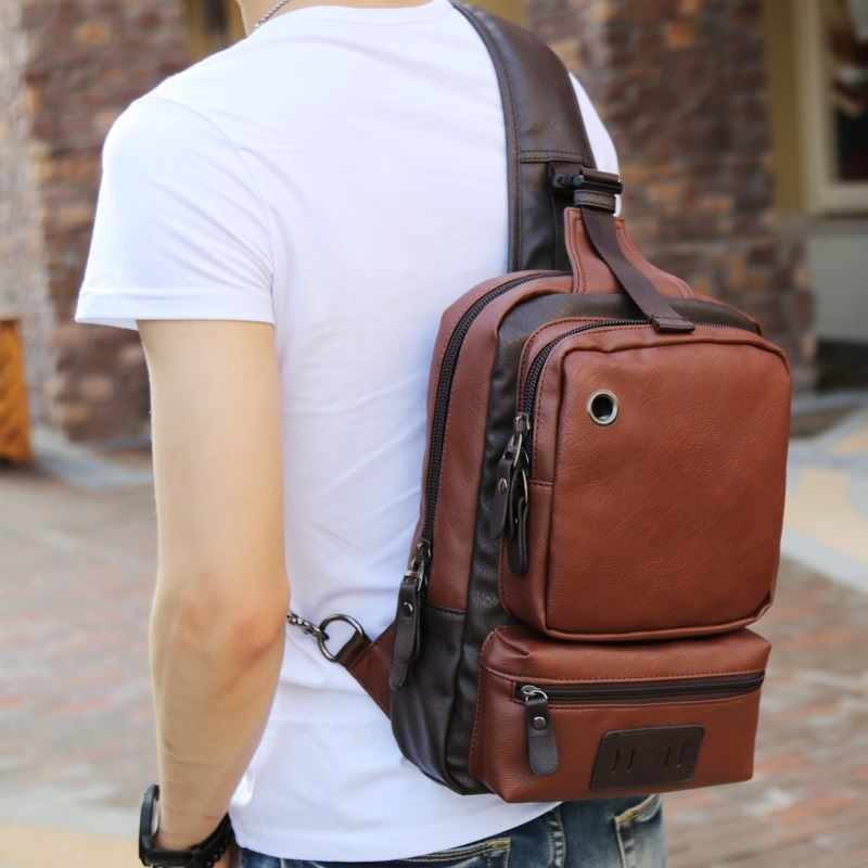 Men's casual shoulder crossbody bag by Memories but Unique, featuring compact design and adjustable strap for travel and everyday use.