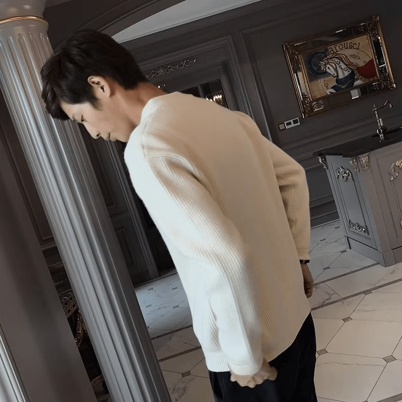 Men's cardigan by Memories but Unique, featuring a cozy knit design in a neutral color, displayed on a hanger.