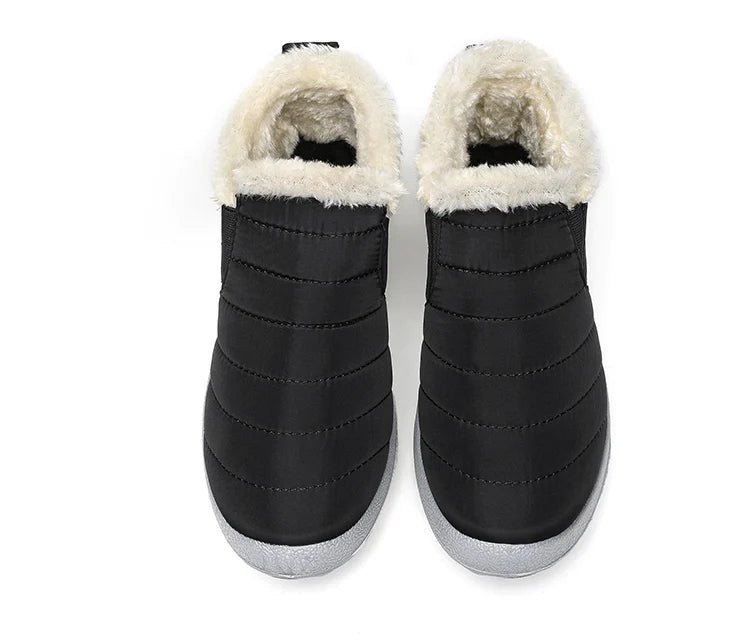 Men's waterproof slip-on winter ankle boots with fur lining and snow-ready design, ideal for cold weather and casual winter wear.