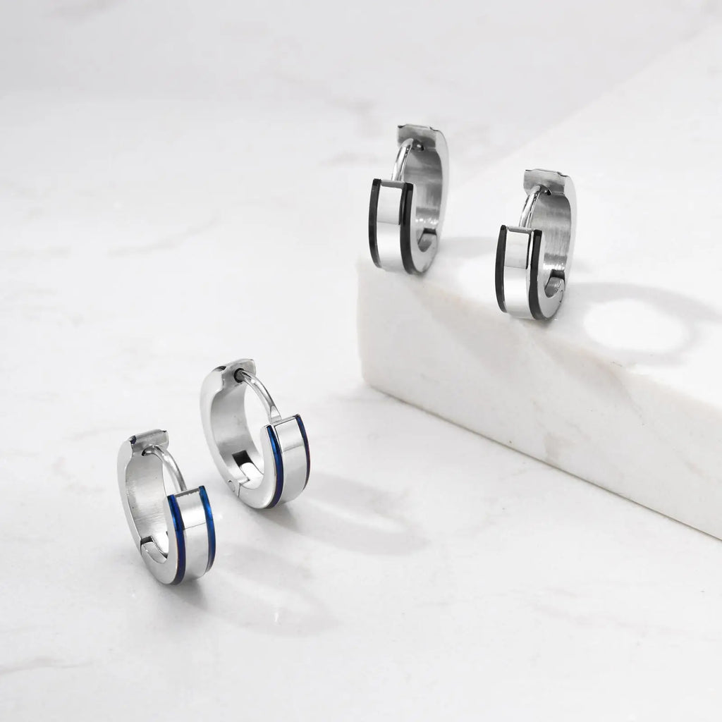 Simple men's stainless steel hoop earrings, casual circle huggies from Memories but Unique, showcasing their sleek, modern design.