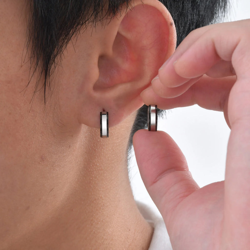 Simple men's stainless steel circle huggie earrings, casual jewelry by Memories but Unique, close-up of classic hoop design