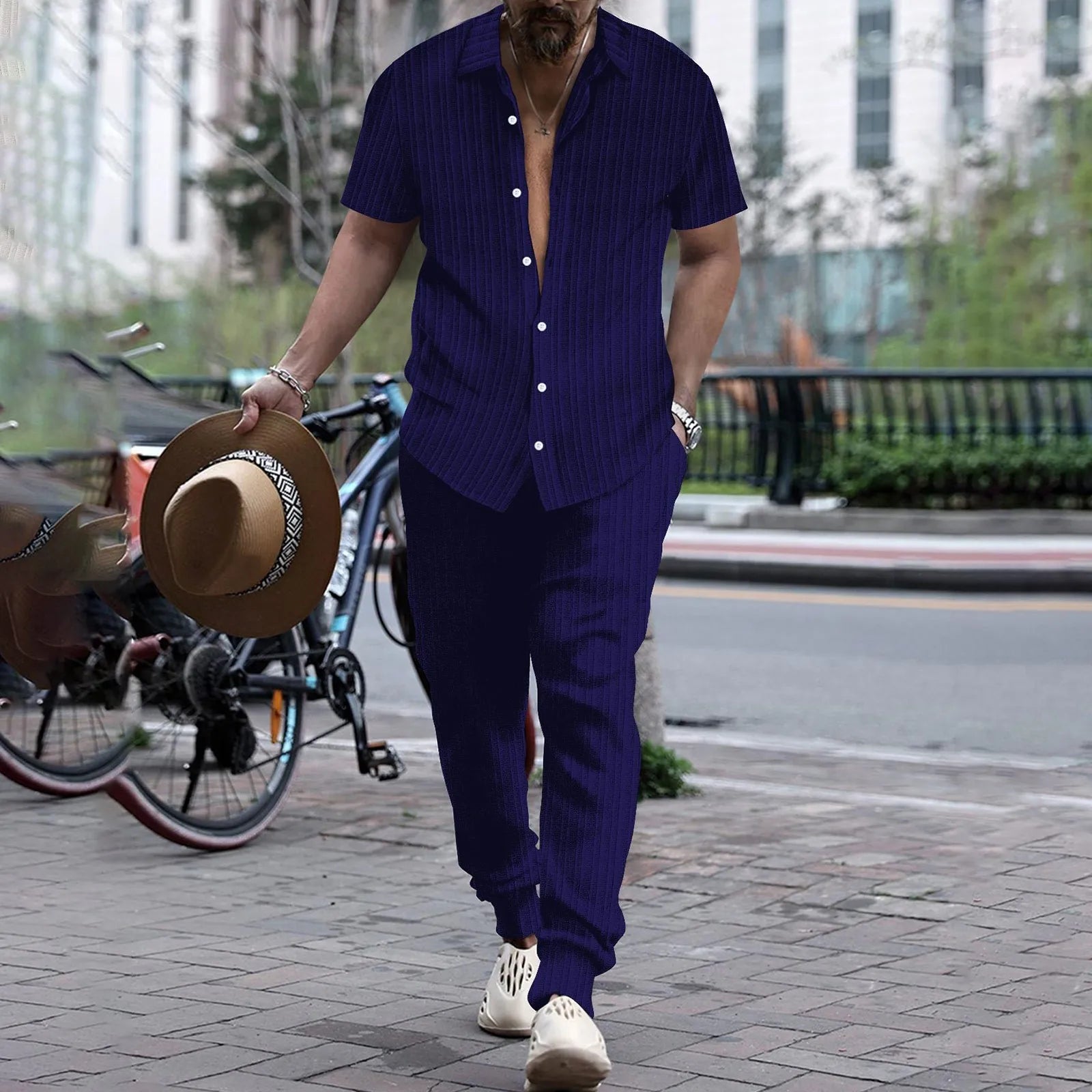 Casual men's summer two-piece set with short sleeve shirt, cardigan, blouse top, and pants, in a stylish beach-ready fashion.