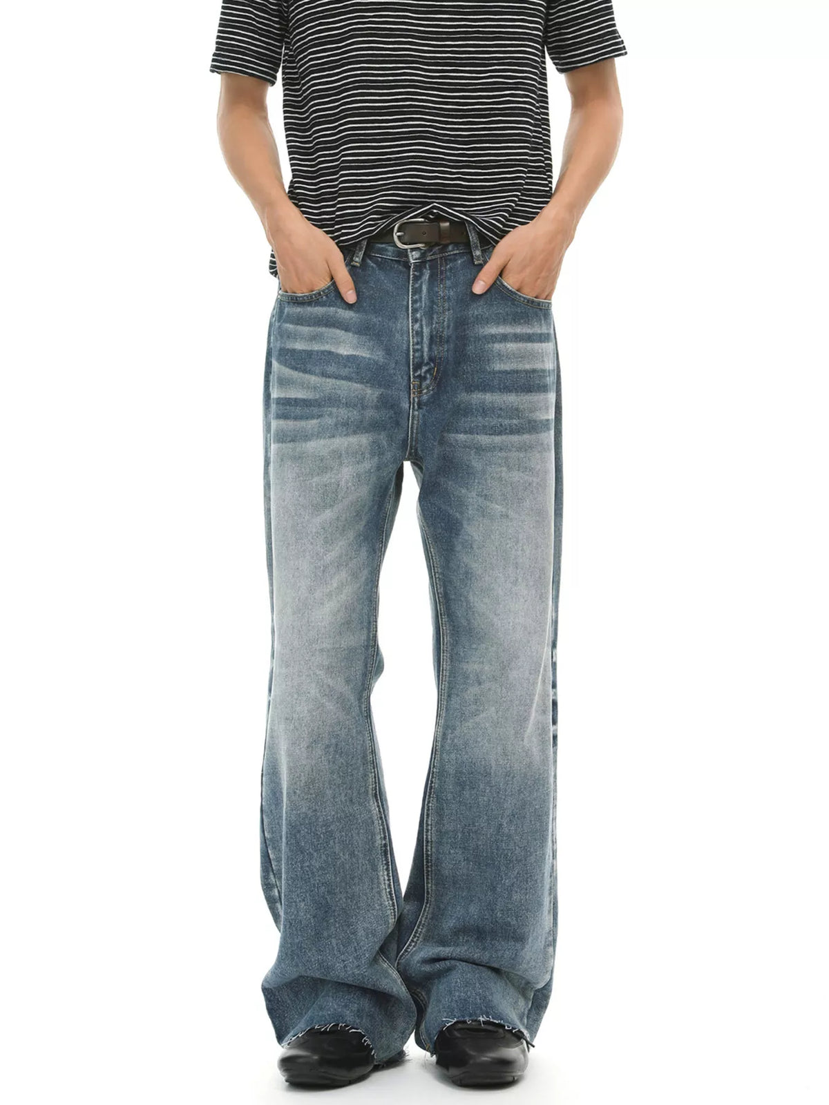 Men's vintage wash flare jeans with raw hem and pockets by Trendsi, shown with a relaxed fit and classic denim texture.