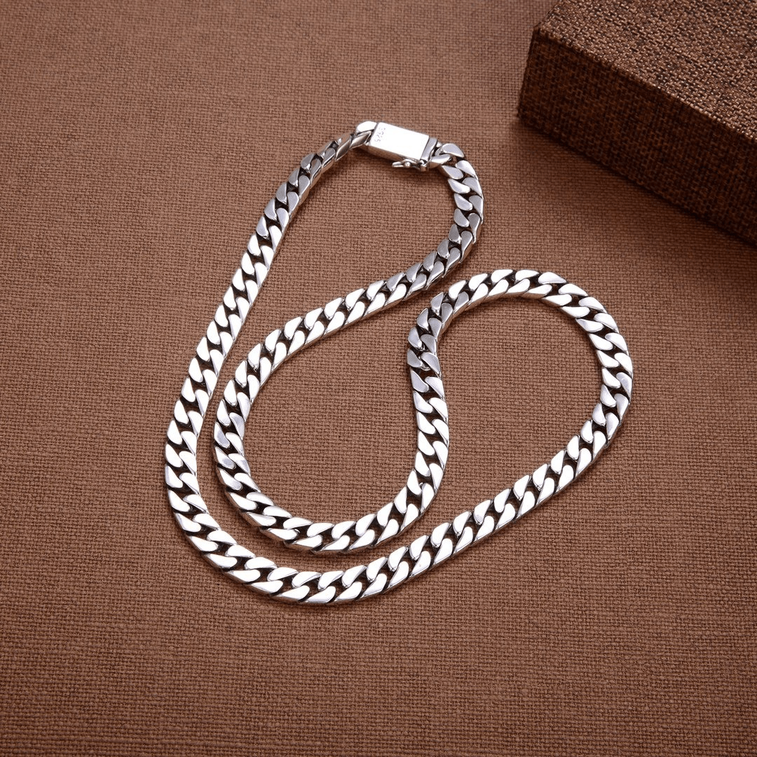 Men's fashion chain clutch by Memories but Unique featuring a stylish chain strap and sleek design for versatile accessories.