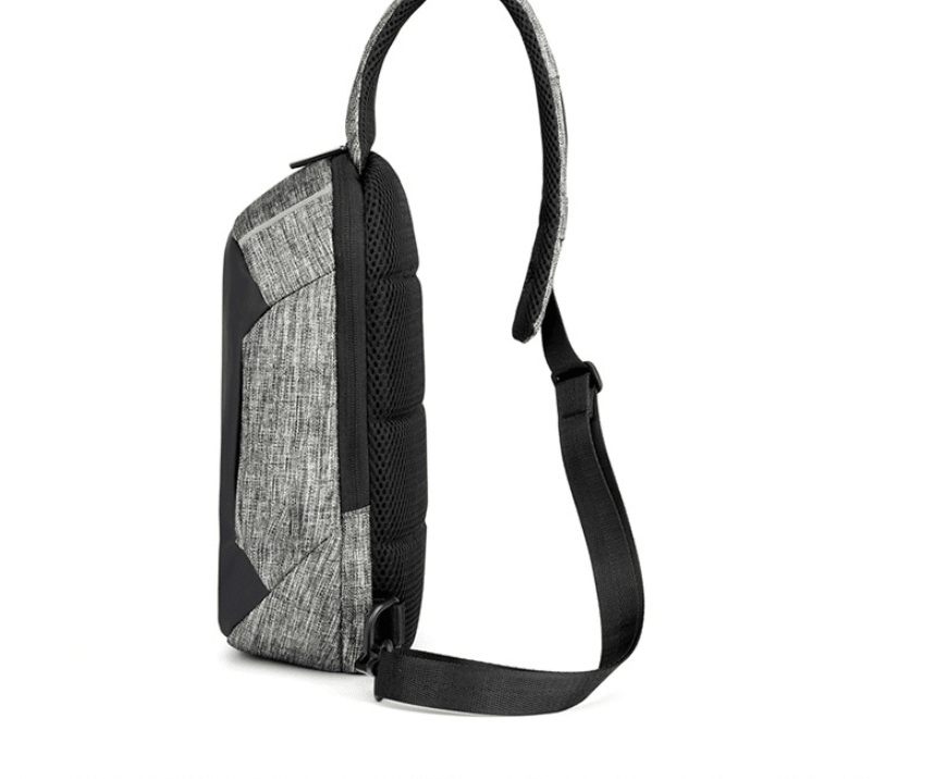 Waterproof anti-theft men's travel chest bag by Memories but Unique, featuring secure zippers and adjustable strap for safe travel.