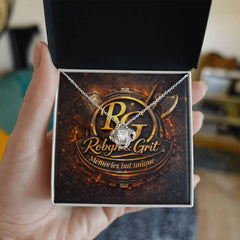Gold tangled love jewelry piece from ShineOn Fulfillment featuring intricate intertwined heart design and sparkling accents.
