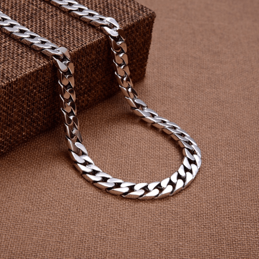 Men's fashion chain clutch by Memories but Unique, featuring a sleek design with a chain strap and stylish exterior.