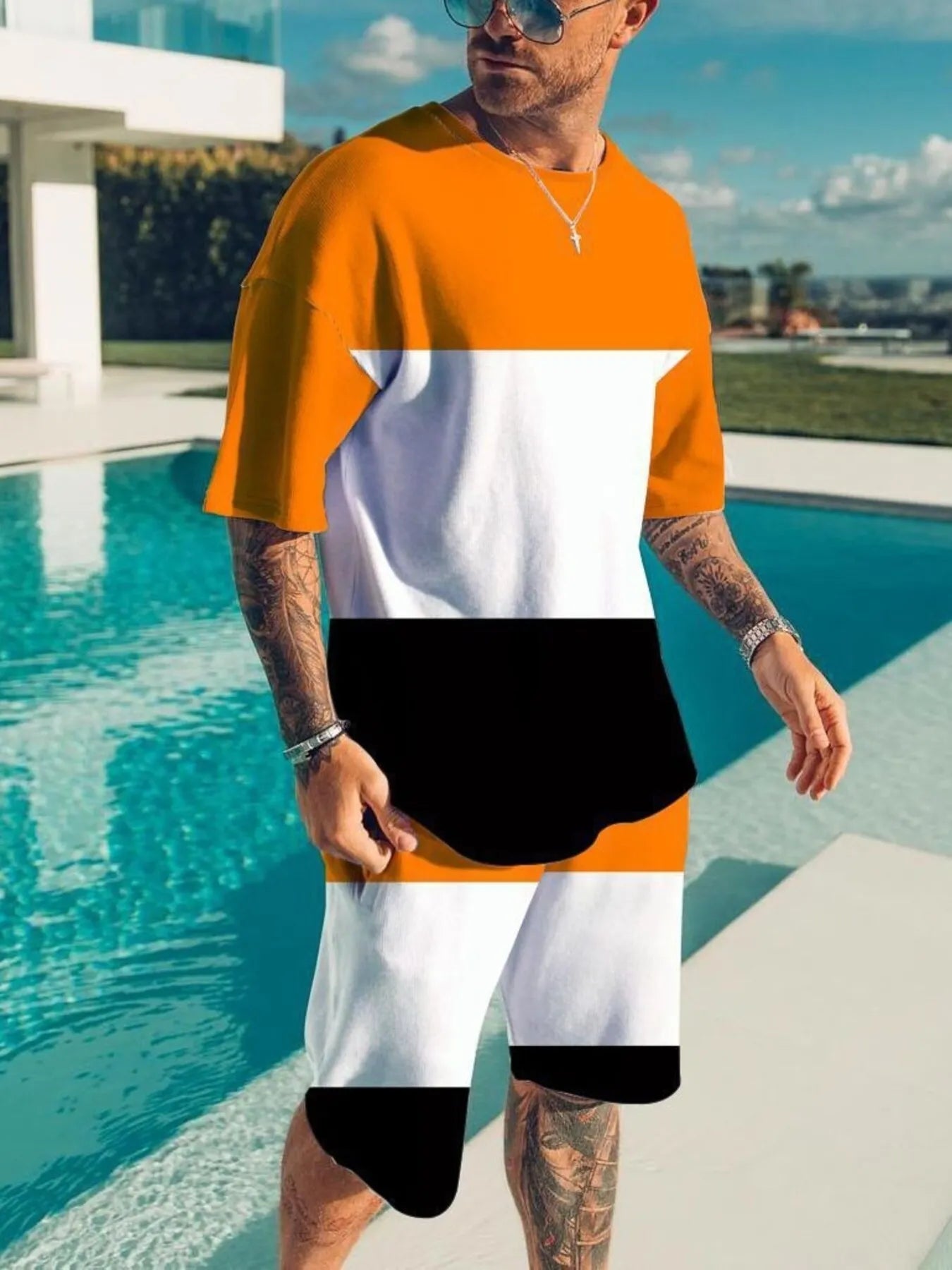 Men's color block tee and shorts set by Trendsi, plus size two-piece casual outfit, featuring a vibrant color block design.