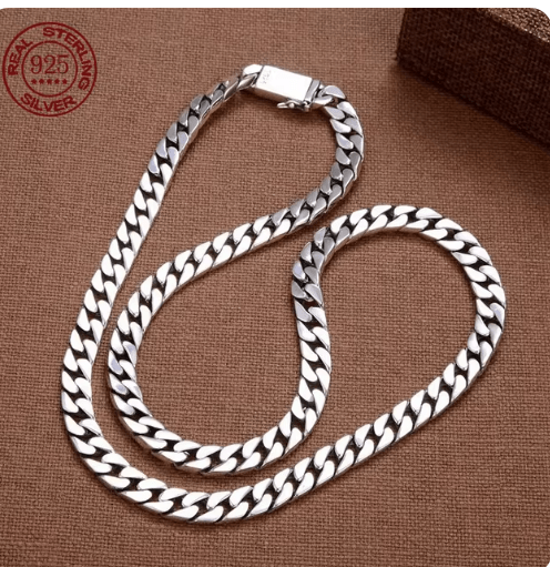Men's fashion chain clutch by Memories but Unique featuring a sleek design with metal chain strap and compact style.