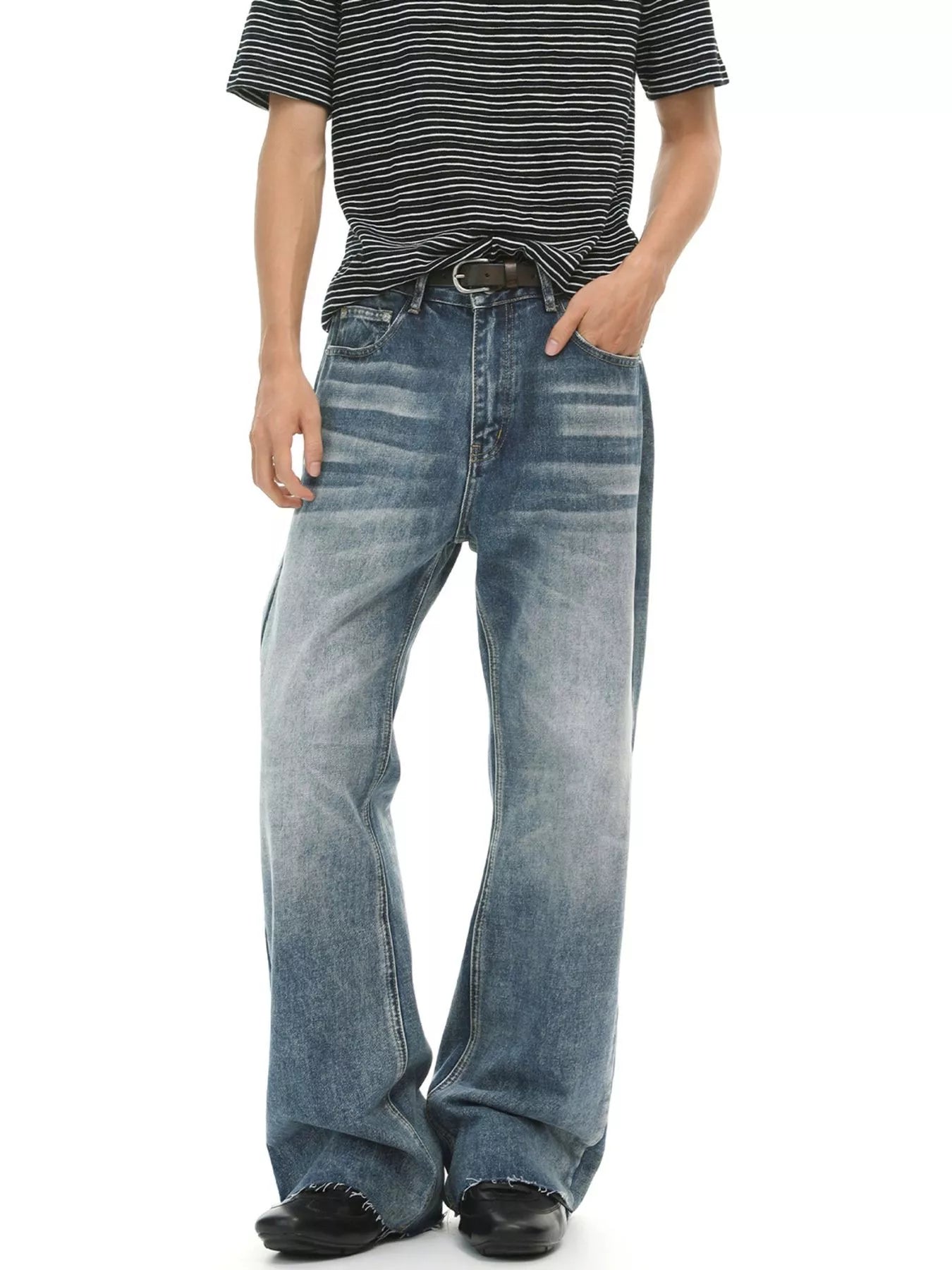 Men's vintage wash flare jeans by Trendsi with raw hem, five pockets, and stylish fit, displayed on a neutral background.