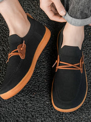 Men's breathable mesh slip-on sneakers by Trendsi, lightweight casual walking shoes with a comfortable mesh design.