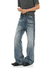 Men's vintage wash flare jeans by Trendsi with raw hem and front pockets, showcasing a casual denim style.