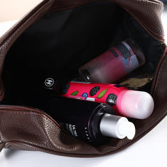 Men's travel cosmetic bag made of PU leather, Zen toiletry organizer with multiple compartments for toiletries and grooming essentials.